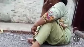 Sultry Desi Auntie Puffing On A Smoke